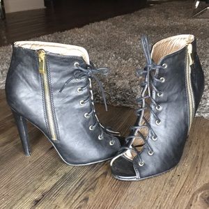 Black laced up zippered heels